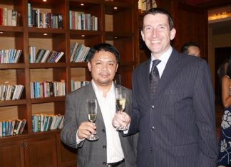 Anuchit Saeng-on and MD Michael Delargy raise their glasses to a good evening had by all.